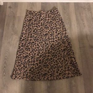 Cheetah pattern skirt with a light pink/beige back drop